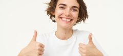 close-up-happy-brunette-woman-shows-thumbs-up-approves-something-recommends-gives-positive.jpg